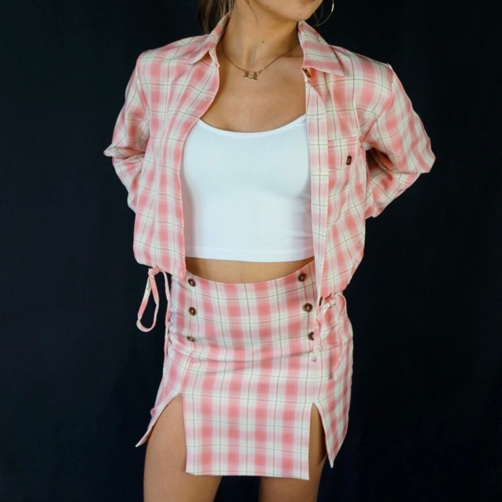 Pink plaid mini skirt with button detail